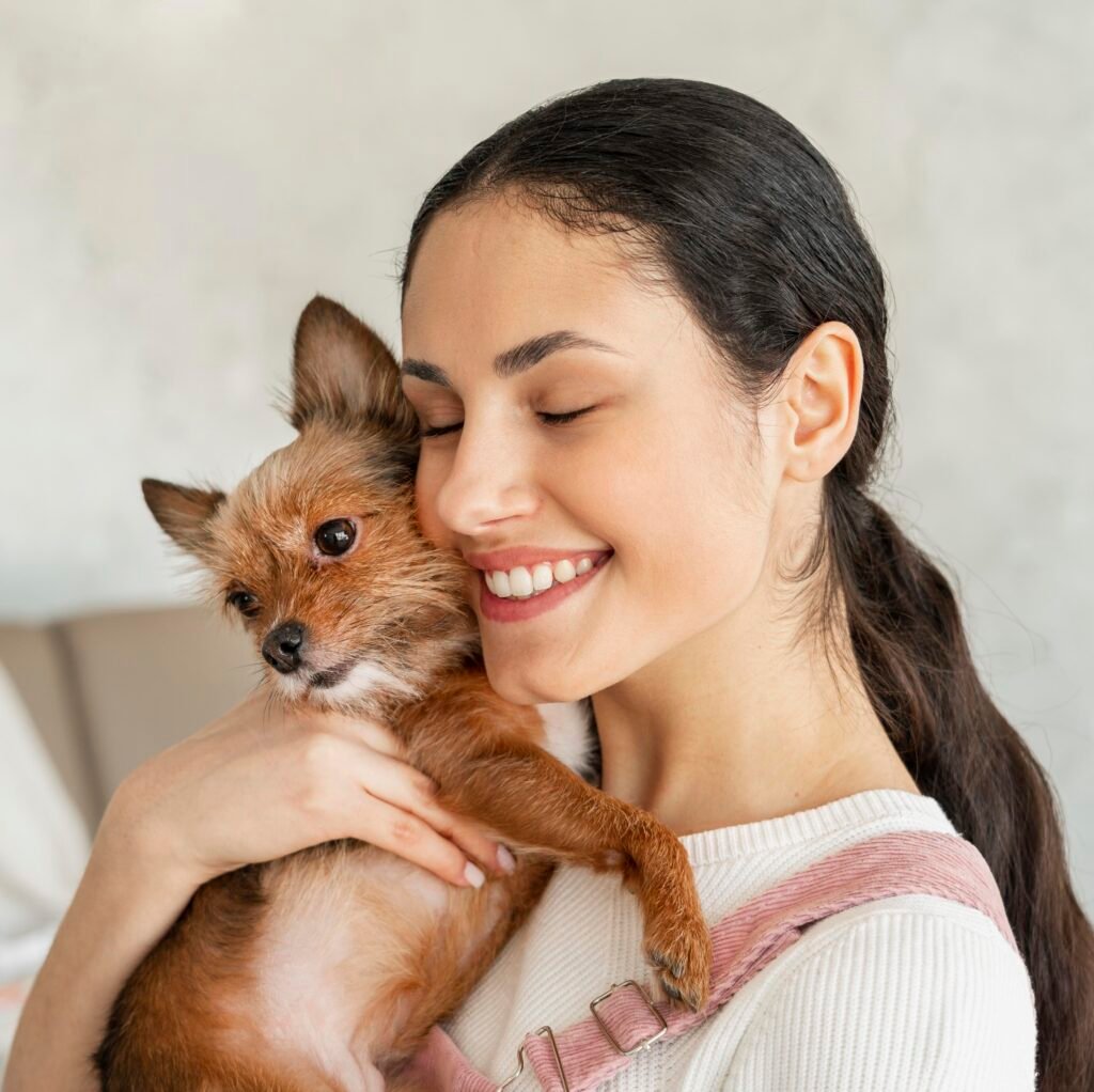 close up smiley girl hugging pet