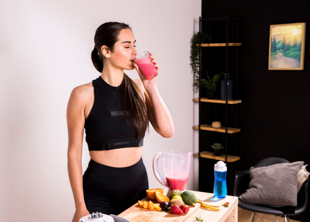 fitness woman drinking detox juice