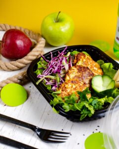 side view broccoli potato cutlet served with cabbage salad delivery box wooden table